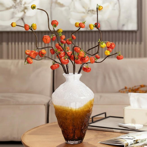 Amber and white textured glass vase with red berry branches