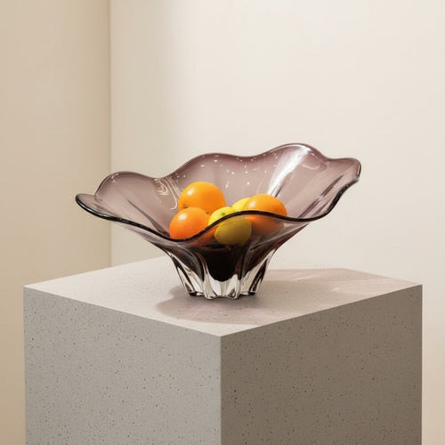 High angle view of amethyst wavy glass bowl with fruit