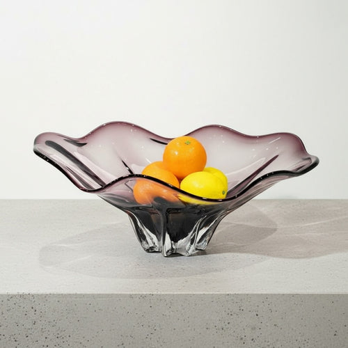 Side profile of purple gradient glass centerpiece bowl on white table