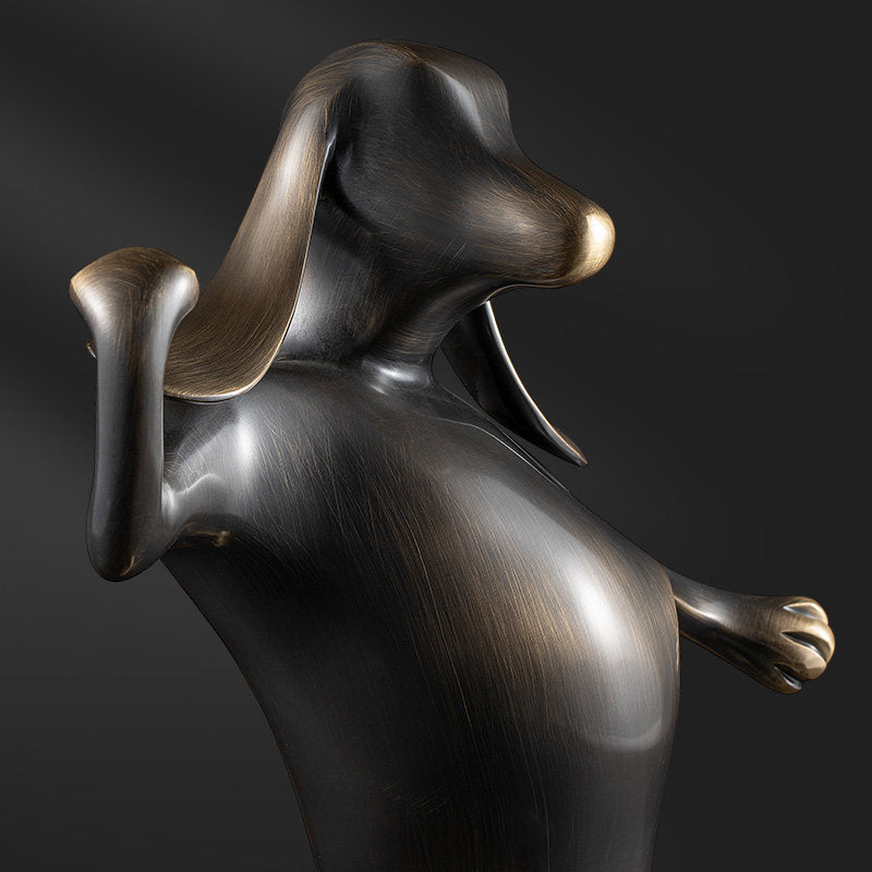 Close up detail of brass dog head and brushed texture
