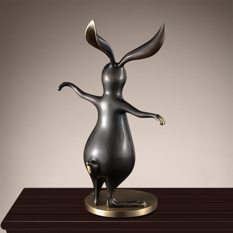 Back view of antique brass rabbit statue
