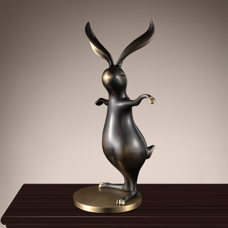Side profile of dancing rabbit brass decor