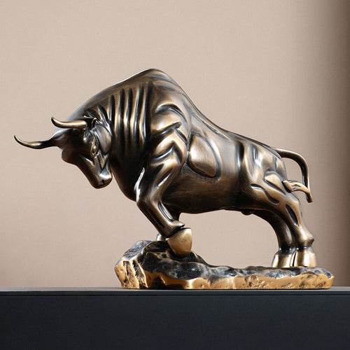 Angled view of muscular copper bull statue with antique finish