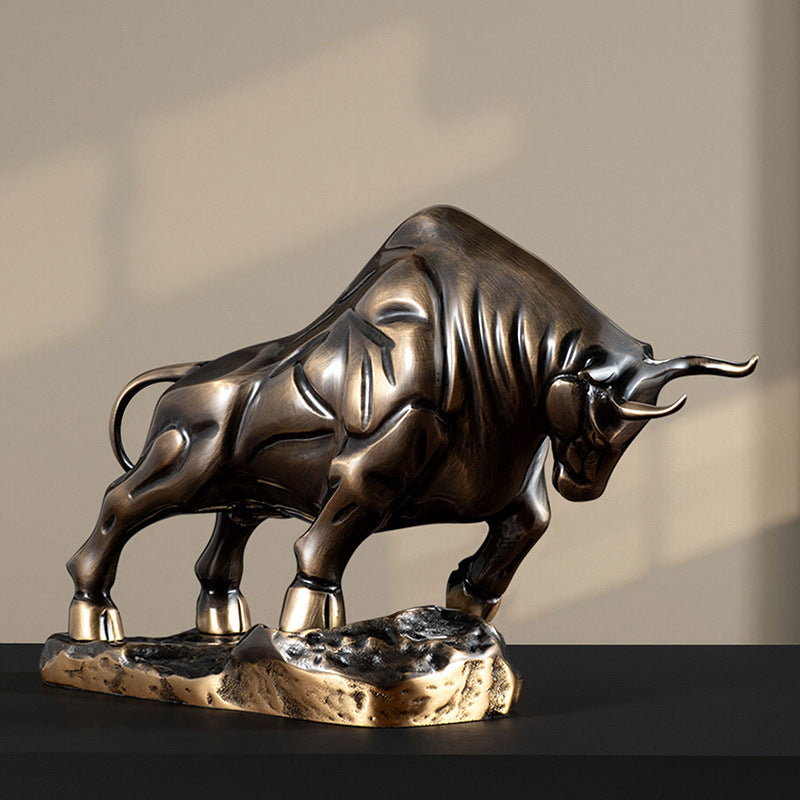 Rear angle view of charging bull sculpture showing dynamic movement