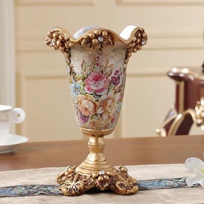 Antique gold resin vase with floral relief and crystal details