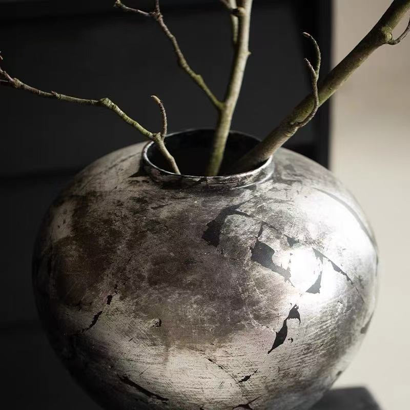 Top view of antique silver vase showing rim detail