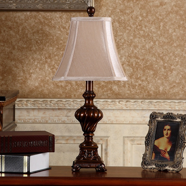 Full view of walnut finish resin spiral table lamp with shade