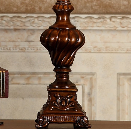 Detail of ornate scrolled base and spiral column