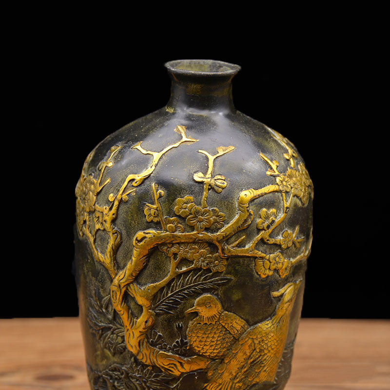 Side angle view of floral and bird relief details