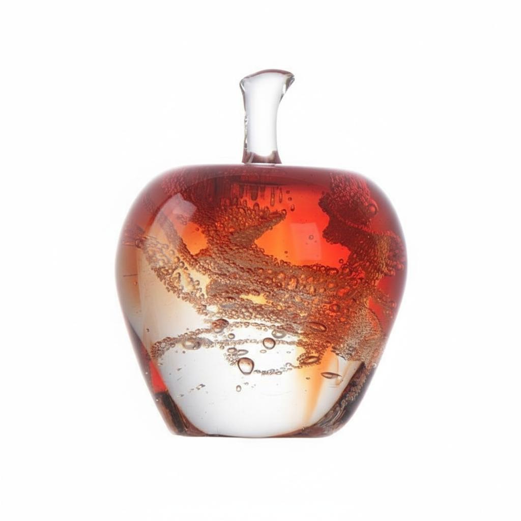 Close up of red amber art glass apple with internal bubbles