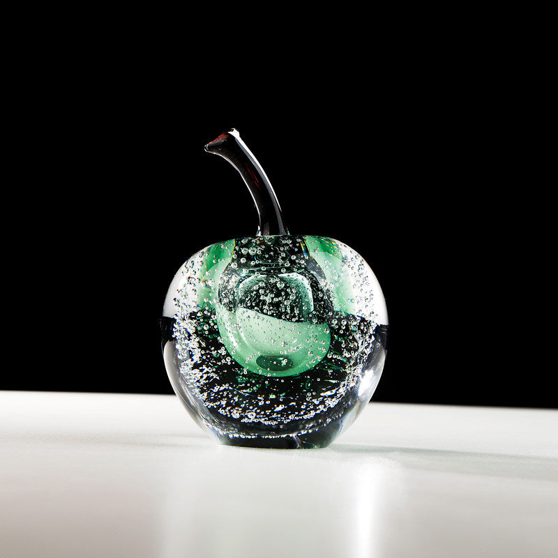 Green glass apple sculpture with bubble detail and dark stem