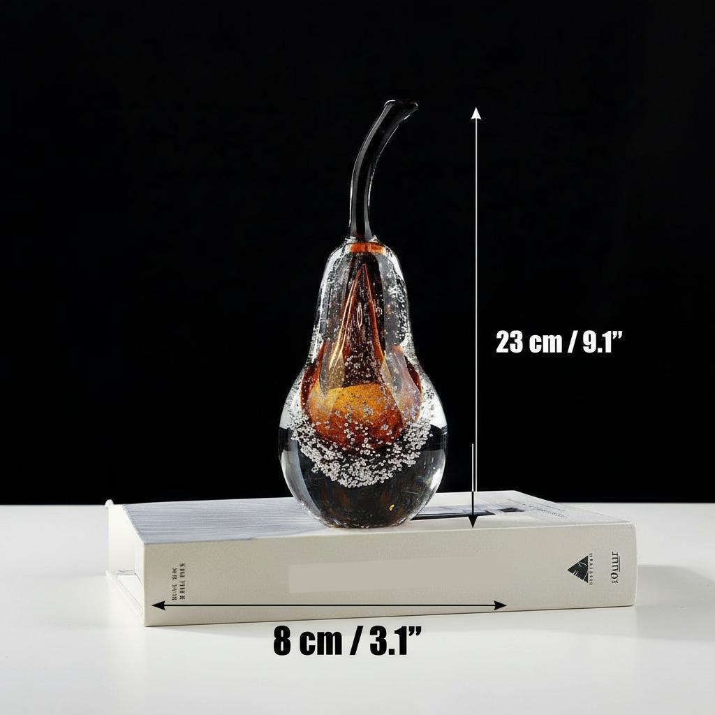 Detailed view of amber glass pear sculpture