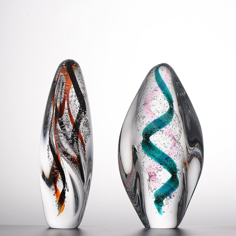 Art glass teardrop sculpture with internal colored spirals
