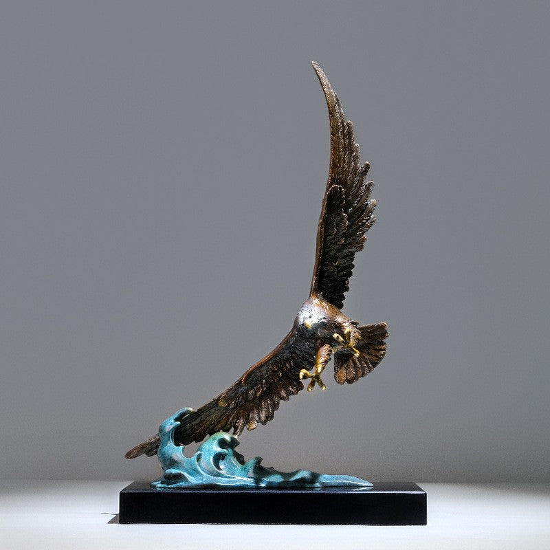 Side profile of brass eagle sculpture swooping over turquoise patina waves