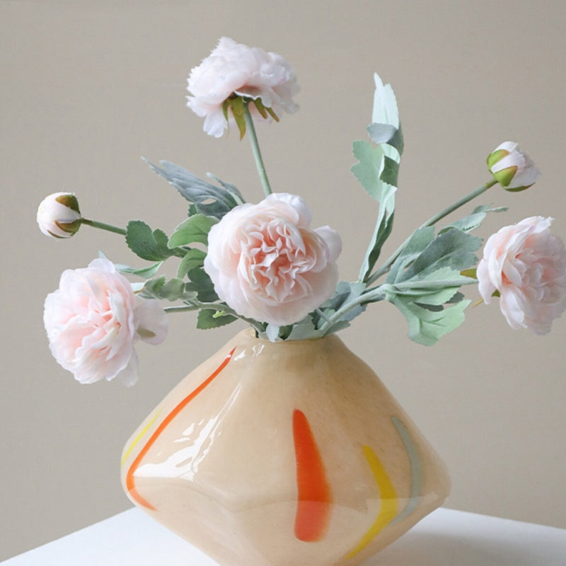 Beige art glass geometric vase with pink flowers