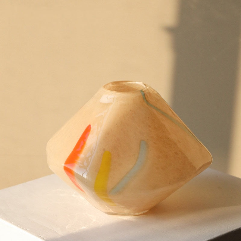 Side view of beige art glass vase showing transparency