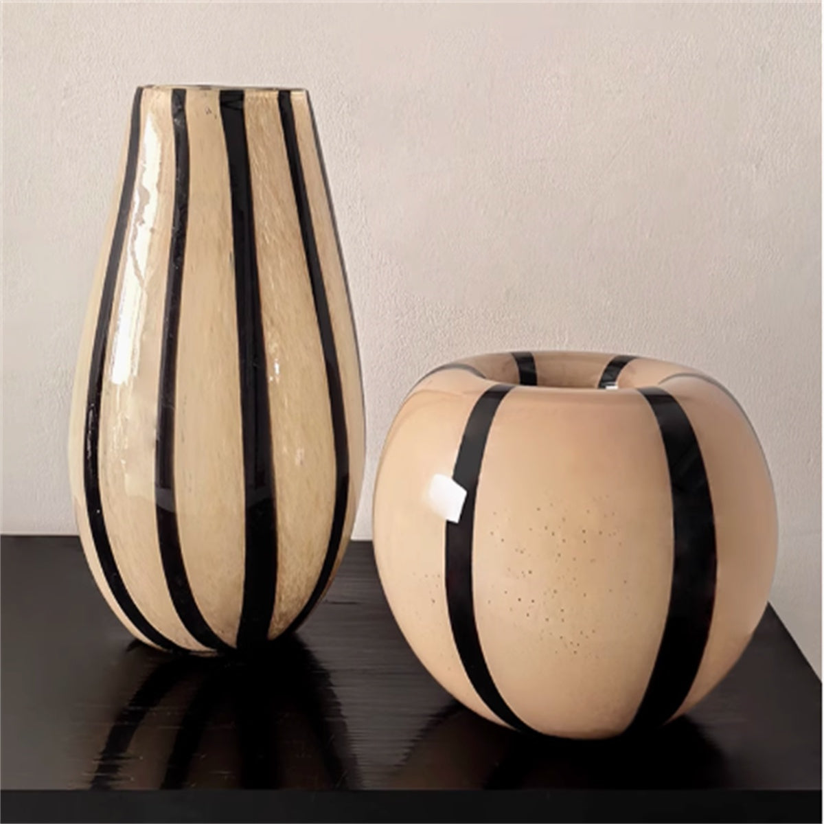 Teardrop and round beige glass vases with black stripes
