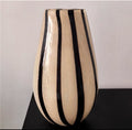Large teardrop beige and black striped vase detail