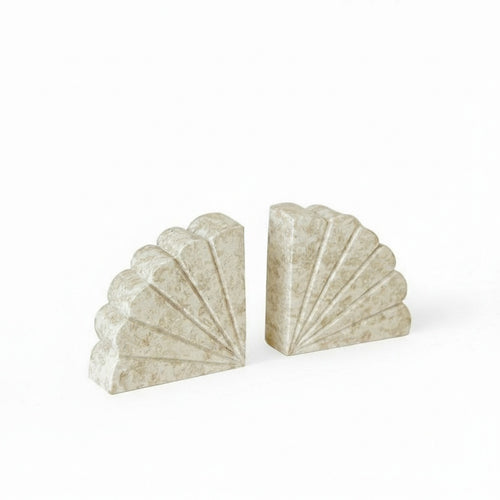 Pair of scalloped beige marble bookends front view
