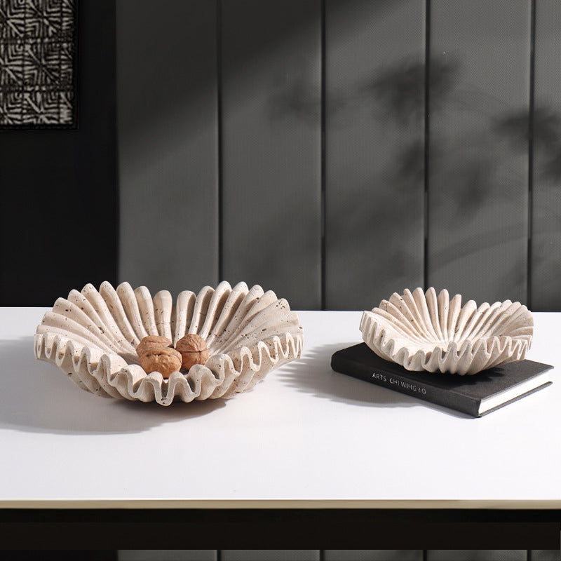 Large and medium marble scalloped bowls side by side