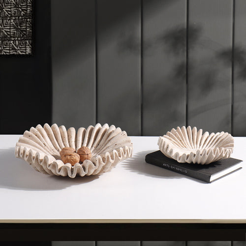 Large and medium marble scalloped bowls side by side