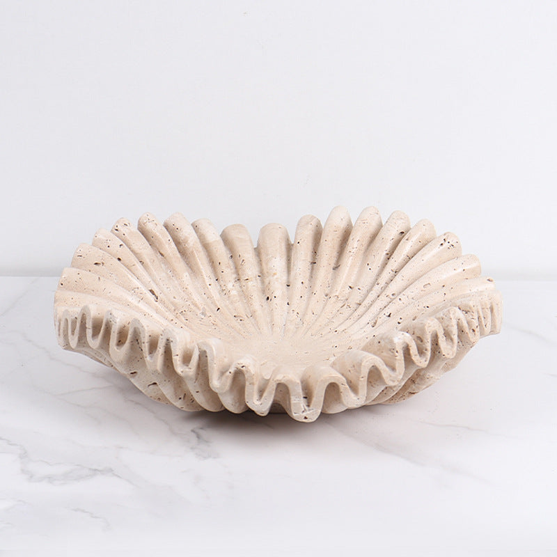 Front view of empty beige stone ruffled bowl