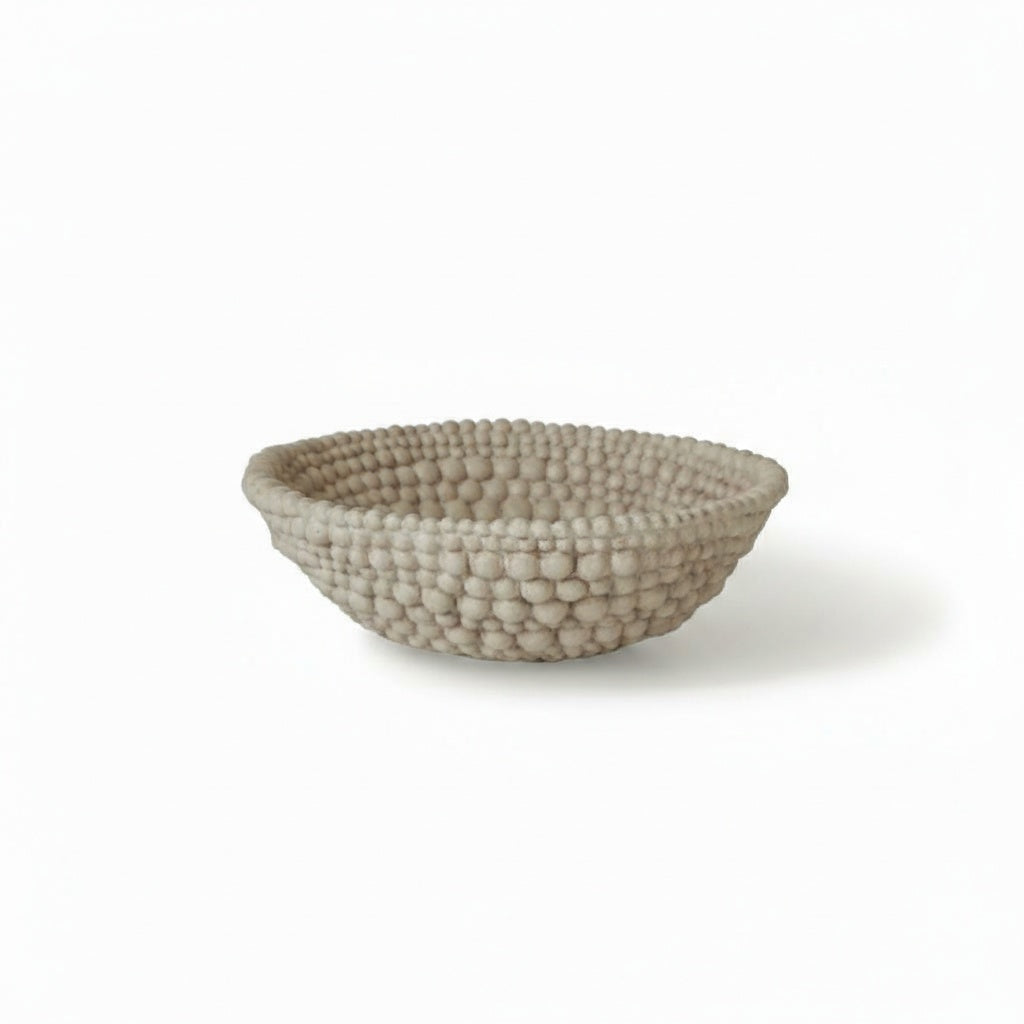 Beige textured ceramic beaded bowl studio view