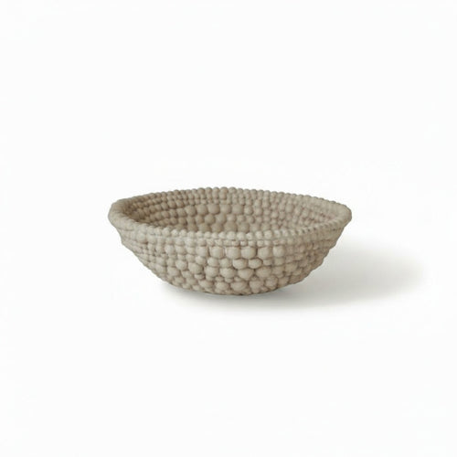Beige textured ceramic beaded bowl studio view