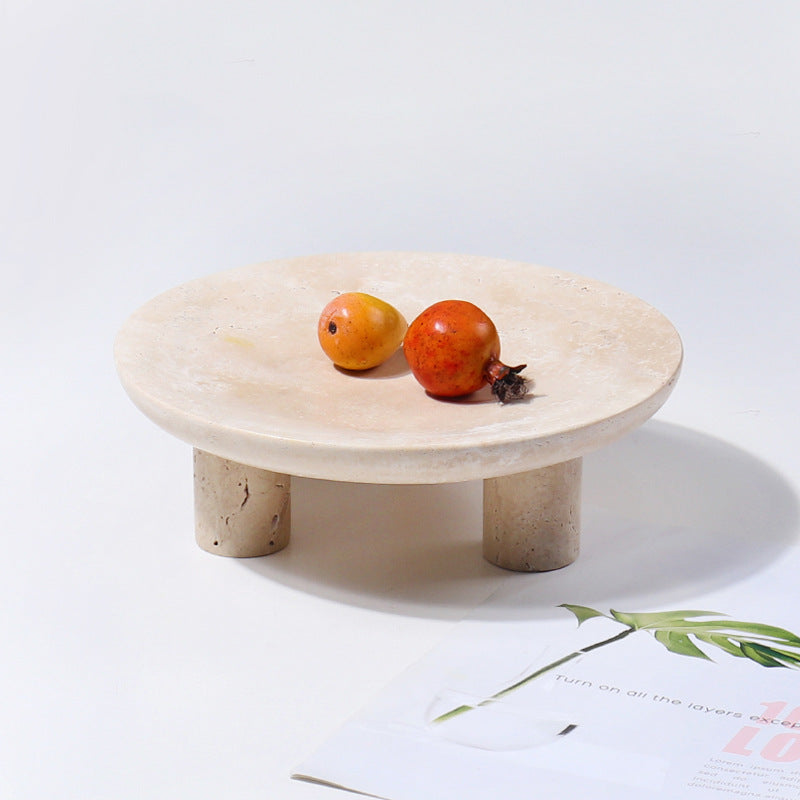 Side view of round natural stone pedestal tray