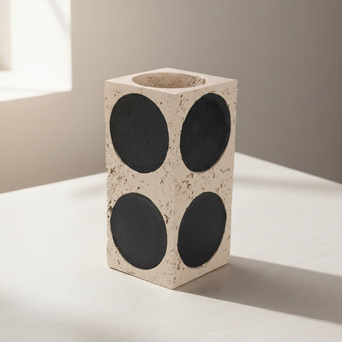 Empty beige stone geometric vase with black circles