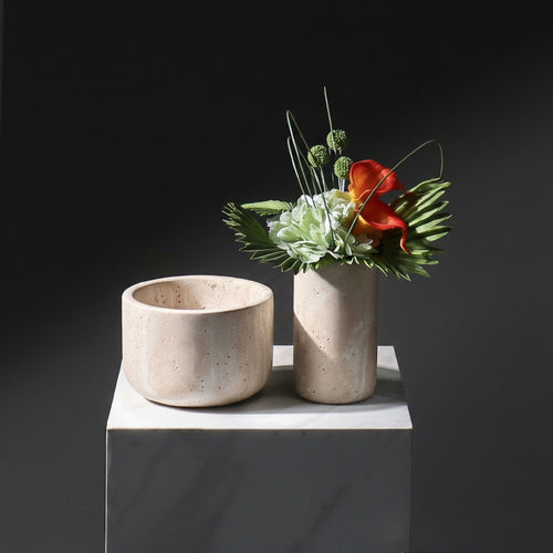 Beige travertine marble vase and bowl set with floral arrangement