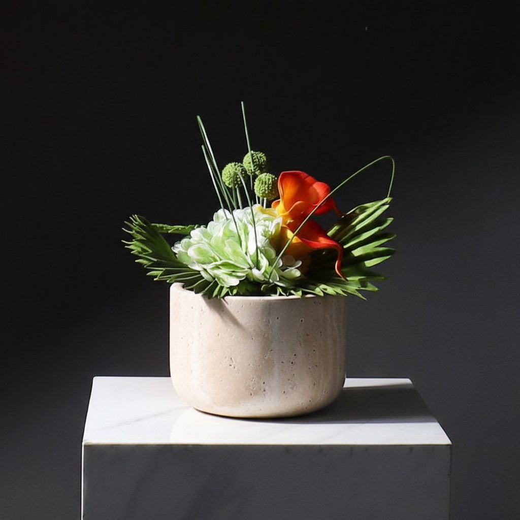 Wide low beige marble bowl planter with green flowers