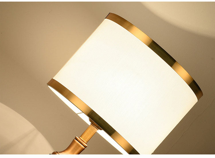 Close up of white shade with gold rim detail from below