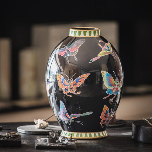 Close up of black butterfly vase showing geometric rim details