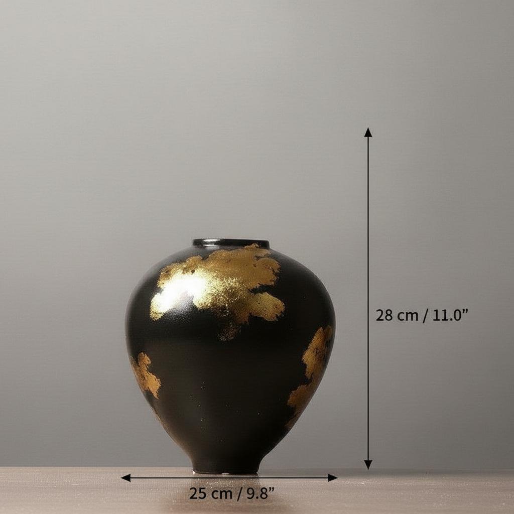 Black ceramic vase with silver metallic abstract details