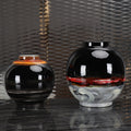 Group shot of large and medium black ceramic vases