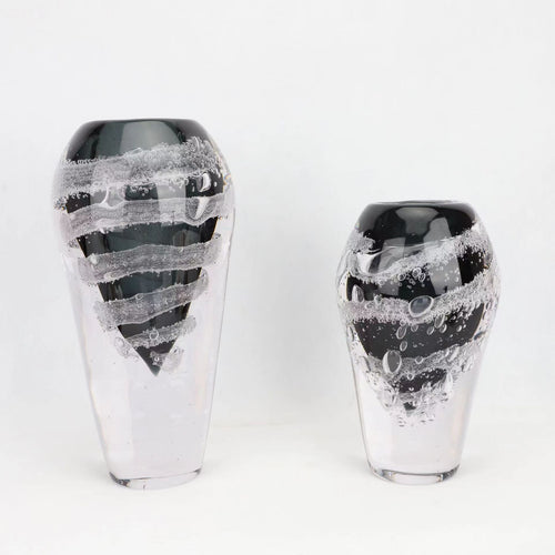 Group of black and clear glass swirl vases
