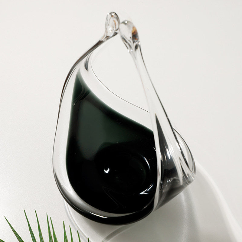 Top down view of empty glass vessel showing dark interior