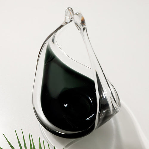 Top down view of empty glass vessel showing dark interior