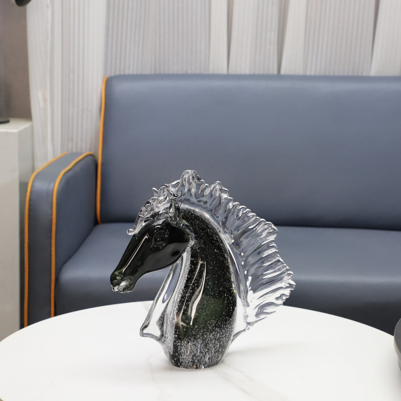 Angled view of art glass horse head with bubble details