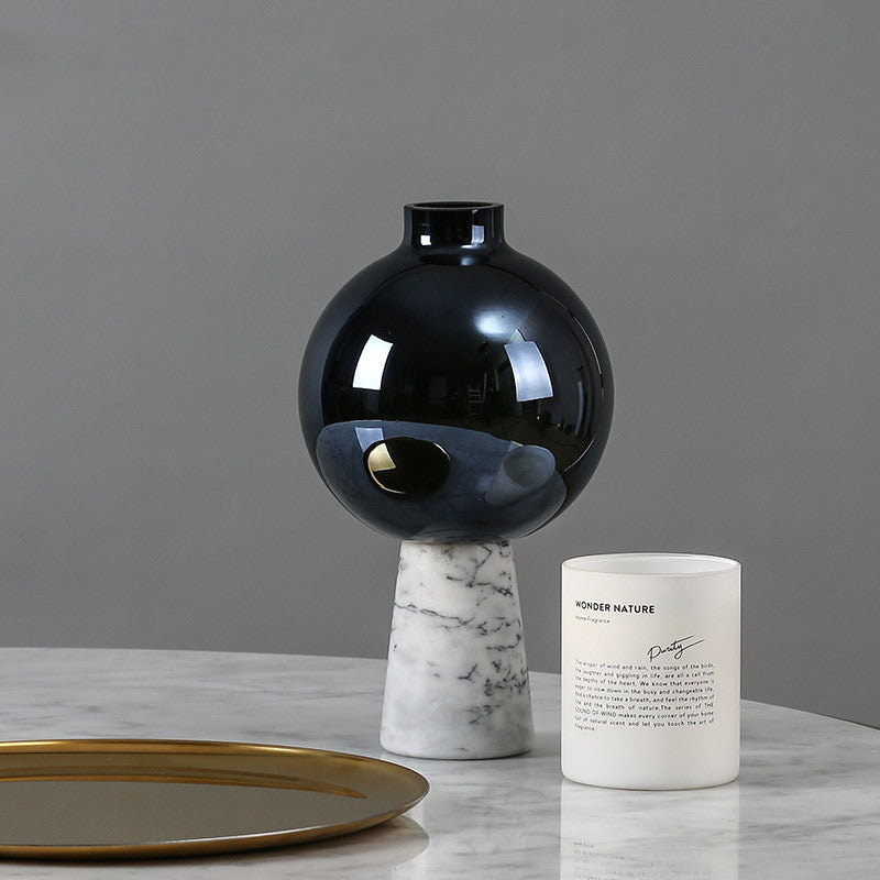 Luxury black glass vase with marble base lifestyle setting