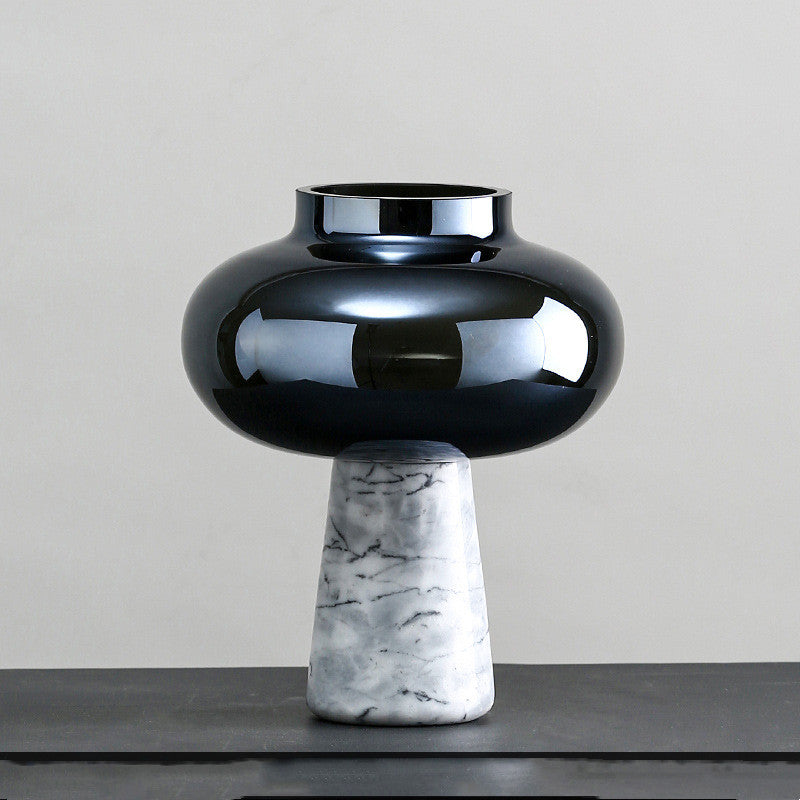Close up of black glass and marble vase