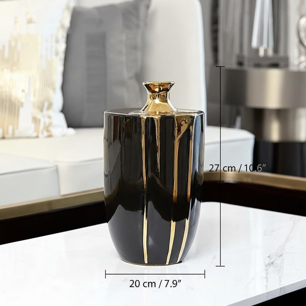 Cylindrical black and gold ceramic vase front view