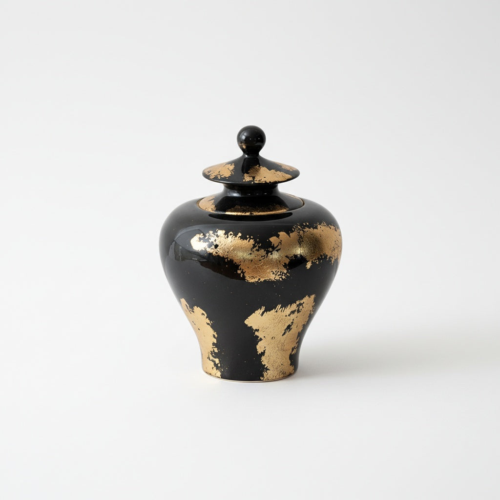 Medium black ceramic temple jar with gold accents front view
