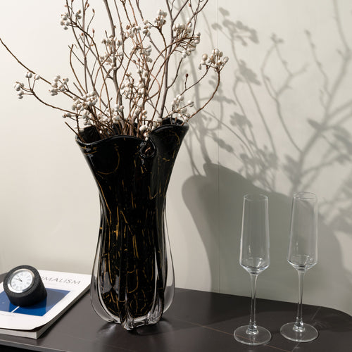 Large black glass wavy vase with gold veining and dried branches