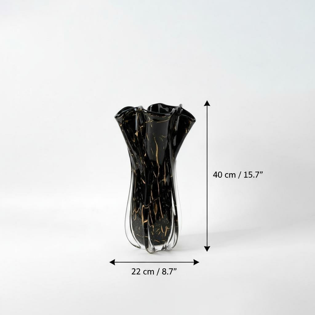 Close up texture of black glass with gold streaks