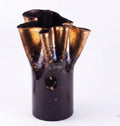 Tall black glass vase with gold interior