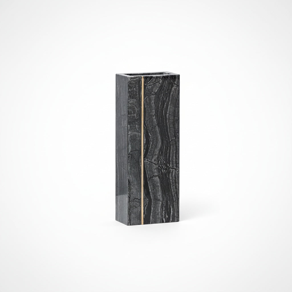 Front view of polished black marble and brass geometric vase