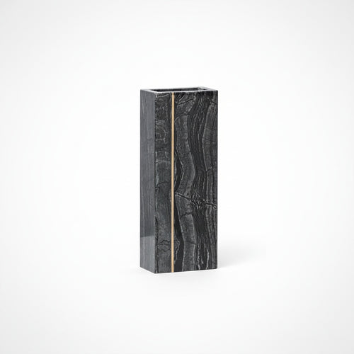 Front view of polished black marble and brass geometric vase