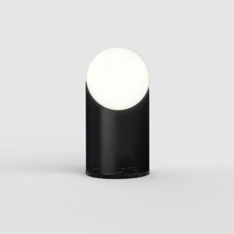 Front view of unlit black marble table lamp